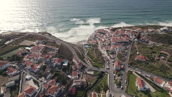 Beautiful small Portugal town on sea coastline, aerial drone view