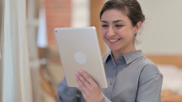Portrait of Young Indian Woman doing Video Call on Tablet