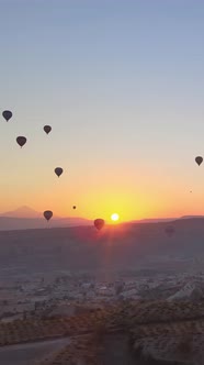 Vertical Video of Hot Air Balloons Flying in the Sky Over Cappadocia Turkey