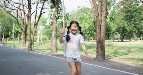 Little girl greeting and playing roller blade