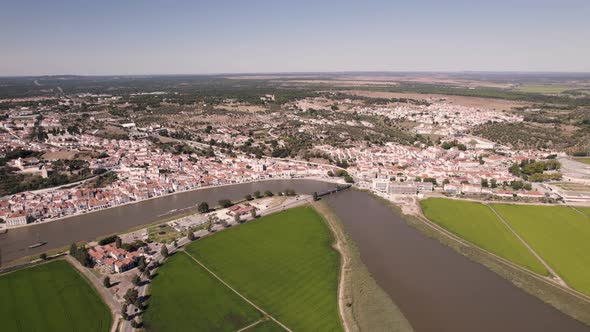 Aerial view of Alcacer do Sal. Traditional Portuguese town. White buildings on riverfront