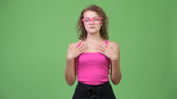 Young Happy Beautiful Nerd Woman Relaxing with Eyes Closed