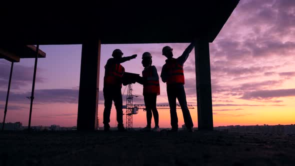 Team of Engineers Are Working at the Sunset Building Lot