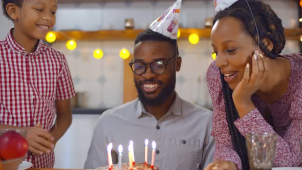 African American Family Celebrating Father Birthday at Home Together