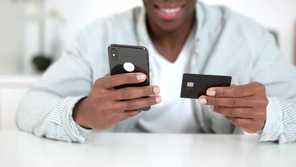 Cell Phone and Credit Card in Male Hands