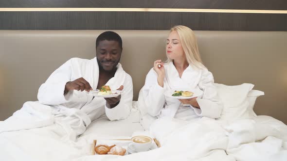 Cute Couple Have Breakfast on Bed