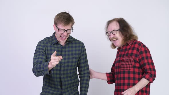 Happy Senior Hipster Man and Young Hipster Man Laughing Together