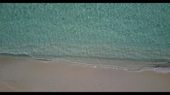 Aerial abstract of tranquil shore beach lifestyle by shallow sea with white sand background of a day