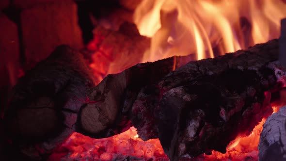 Firewood in oven and fireplace wood. Burning fire, firewood in fireplace