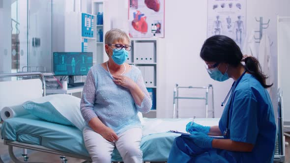 Nurse Talking with Old Senior Patient