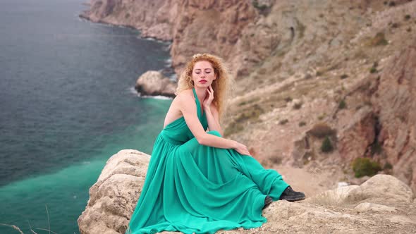 Close Up Shot of Beautiful Young Caucasian Woman with Curly Blond Hair and Freckles Looking at