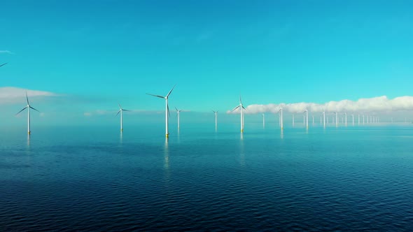 Windmill Park in the Ocean Drone Aerial View of Windmill Turbines Generating Green Energy Electric