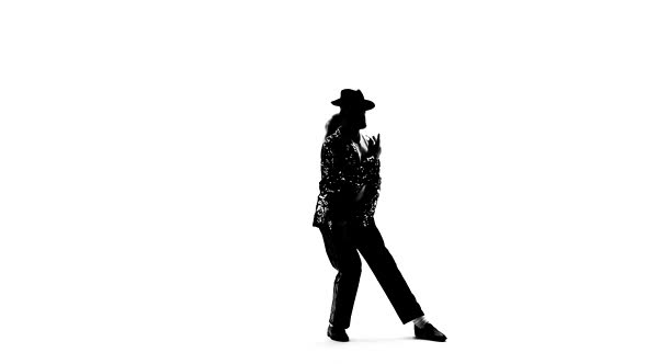Silhouette of a Young Man Dancer Dancing in Style Michael Jackson on White Background. Close Up
