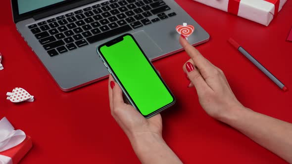Womans Hands Using Smartphone with Green Screen Chroma Key