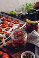 Coating of Sun Dried Tomatoes with Olive Oil in a Jar - PhotoDune Item for Sale