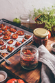 Preserving of Sun Dried Tomatoes with Herbs in a Jar - PhotoDune Item for Sale