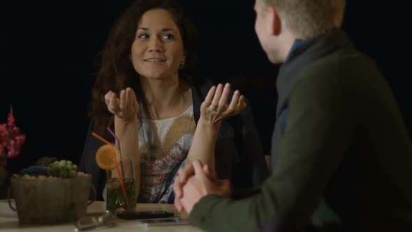 Beautiful Engaged Couple Discussing Wedding Plans, Woman Smiling to Beloved Man