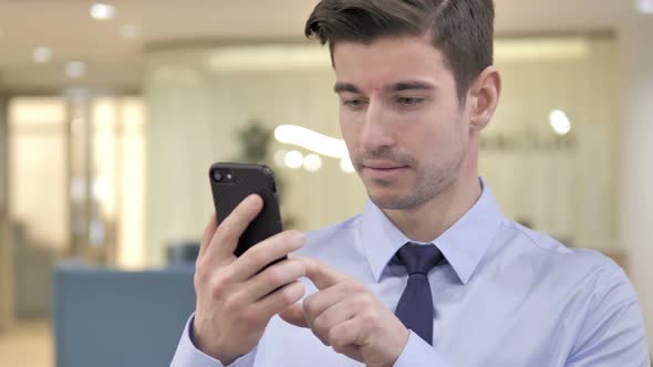 Businessman Using Smartphone, Typing Message