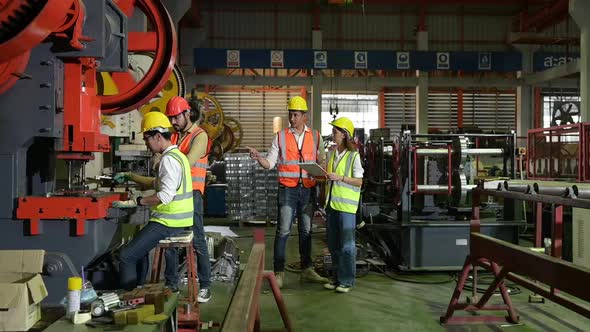 Engineers Testing and verifying the operation of the machines