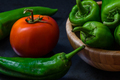 tomato and chili pepper on a dark background - PhotoDune Item for Sale