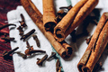 Cinnamon sticks and cloves on cloth - PhotoDune Item for Sale