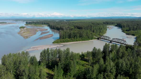 4K Drone Video of Alaska Railroad Train Trestle with Mt. Denali in Distance during Summer