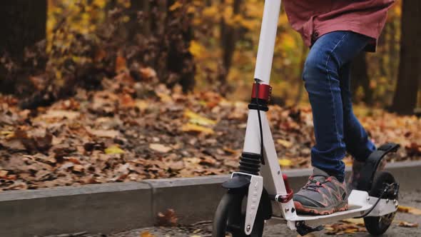 Girl Riding Scooter