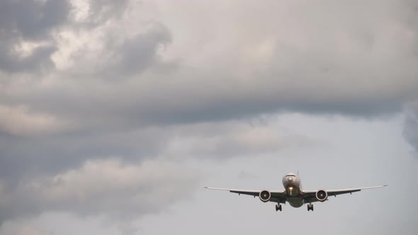 Airplane Approaching Cloudy Sky