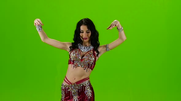 Dancing Belly Dance with Red Dress. Green Screen. Slow Motion