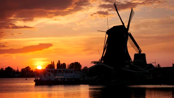 Windmills at Zaanse Schans in Holland on Sunset. Zaandam, Nether