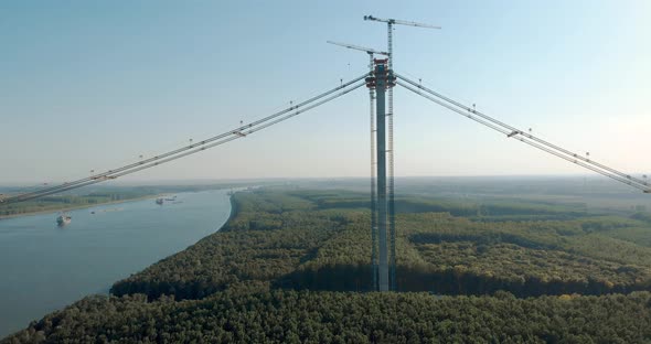 Tower Cranes Erected By The Bank Of Danube River During Construction Of Braila Bridge