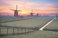 Frost on the meadow with three windmills at sunrise - PhotoDune Item for Sale