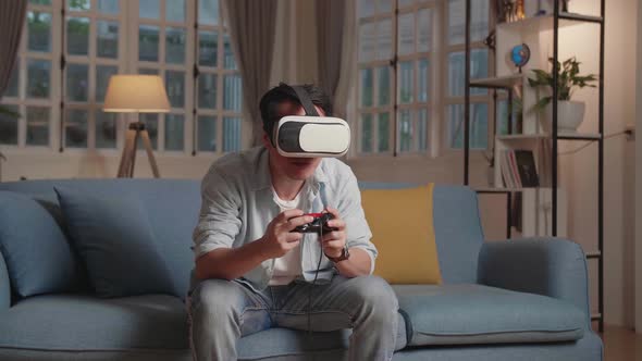 Excited Young Male Gamer Wearing Vr Headsets Playing Video Game At Home