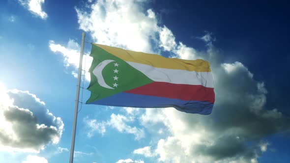 Flag of Comoros Waving at Wind Against Beautiful Blue Sky