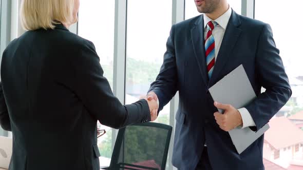 Business People Handshake with Friend at Office