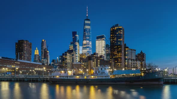 Day to Night Timelapse Sunset Clouds Moving Over One World Trade Center POV view from Pier 25 in Tri