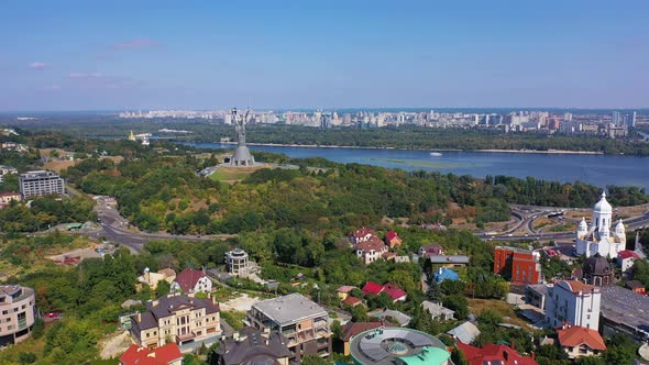 Capital of Ukraine - Kyiv city. Top view of cityscape, blue Dnipro.