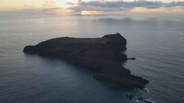 Ilheu de Ferro island at sunset, Porto Santo in Portugal. Aerial forward