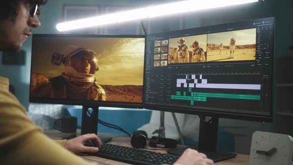 Focused Man Editing Astronaut Video