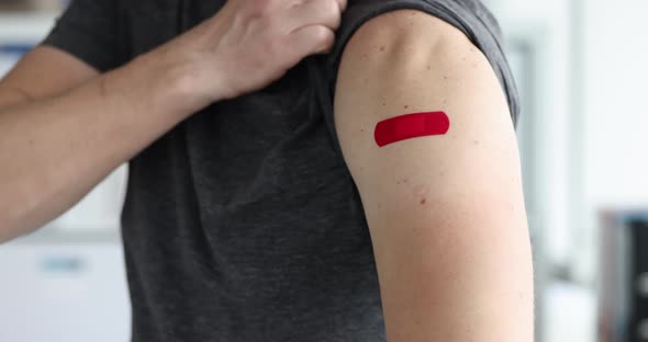 Man Points to Patch on Shoulder After Being Vaccinated  Movie