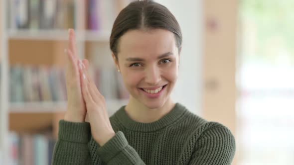 Portrait of Clapping Young Woman Applauding