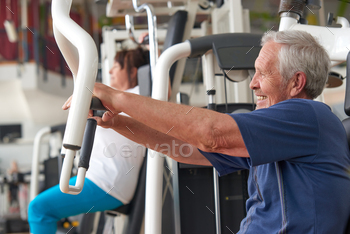 Older man training on press machine at gym club / Photodune, Misc