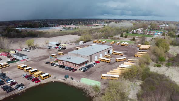 Aerial Drone View of Buses Heading in a Parking Lot