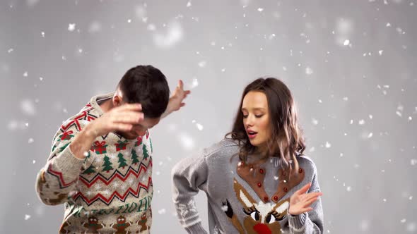 Happy Couple Dancing at Christmas Party