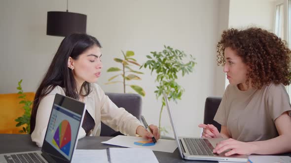 Professional Indian Teacher Manager or Mentor Helping Latin Student New Employee Teaching Intern