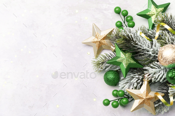 nch with green and gold modern festive ornaments on blue background with copy space