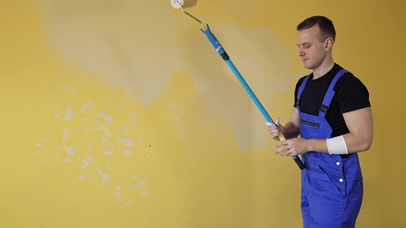 Portrait view of painter hands painting the wall