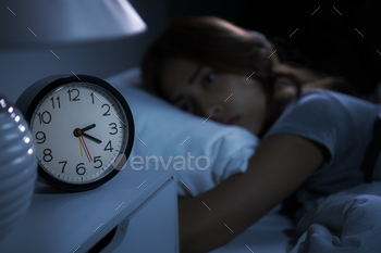 om insomnia. Selective focus on alarm clock