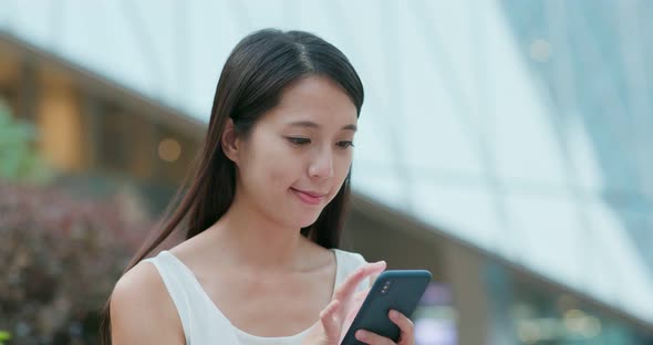 Woman Read on Smart Phone for Online