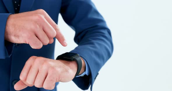 Mid section of businessman using smartwatch 4k